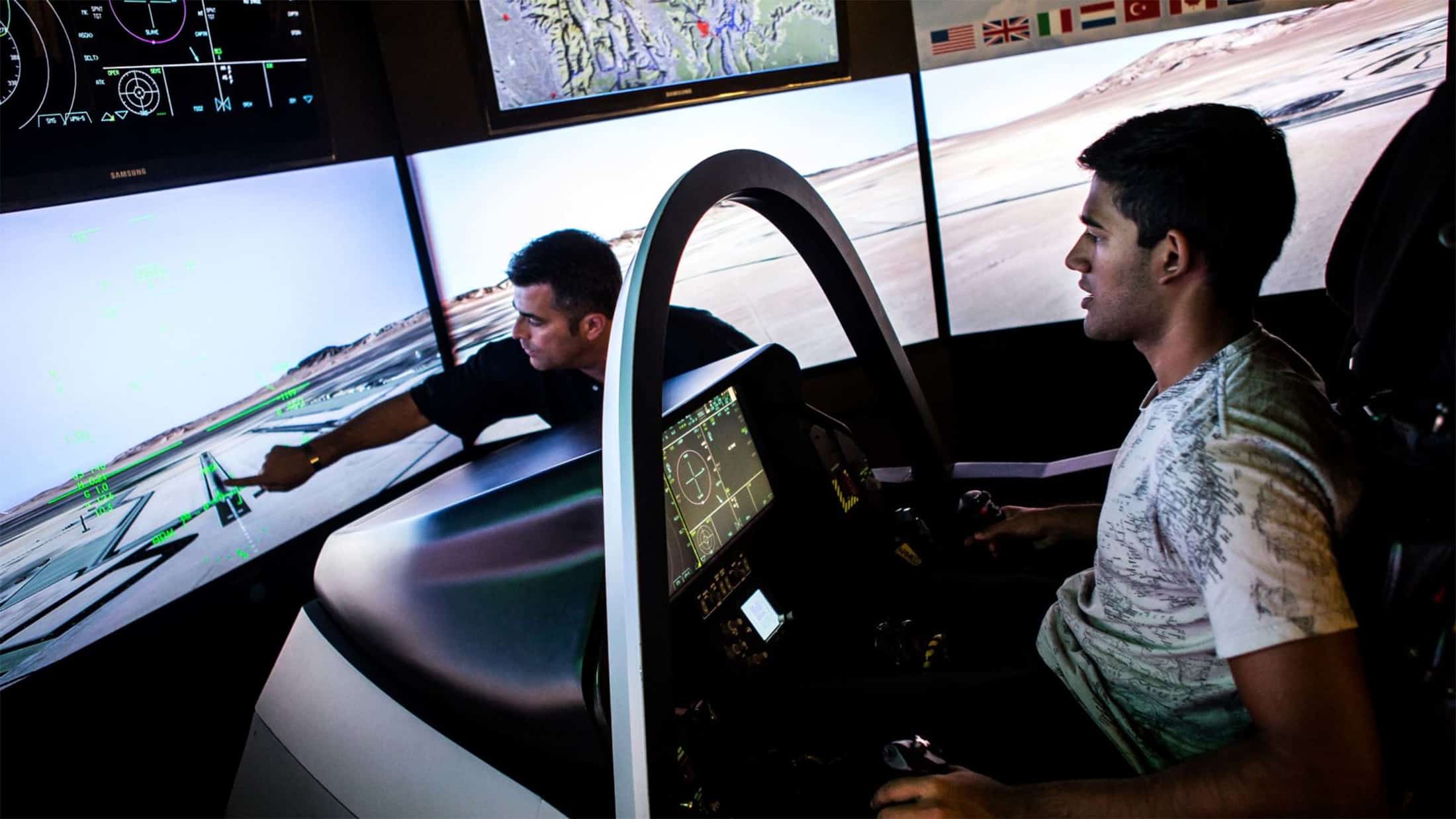 two men in flight simulator